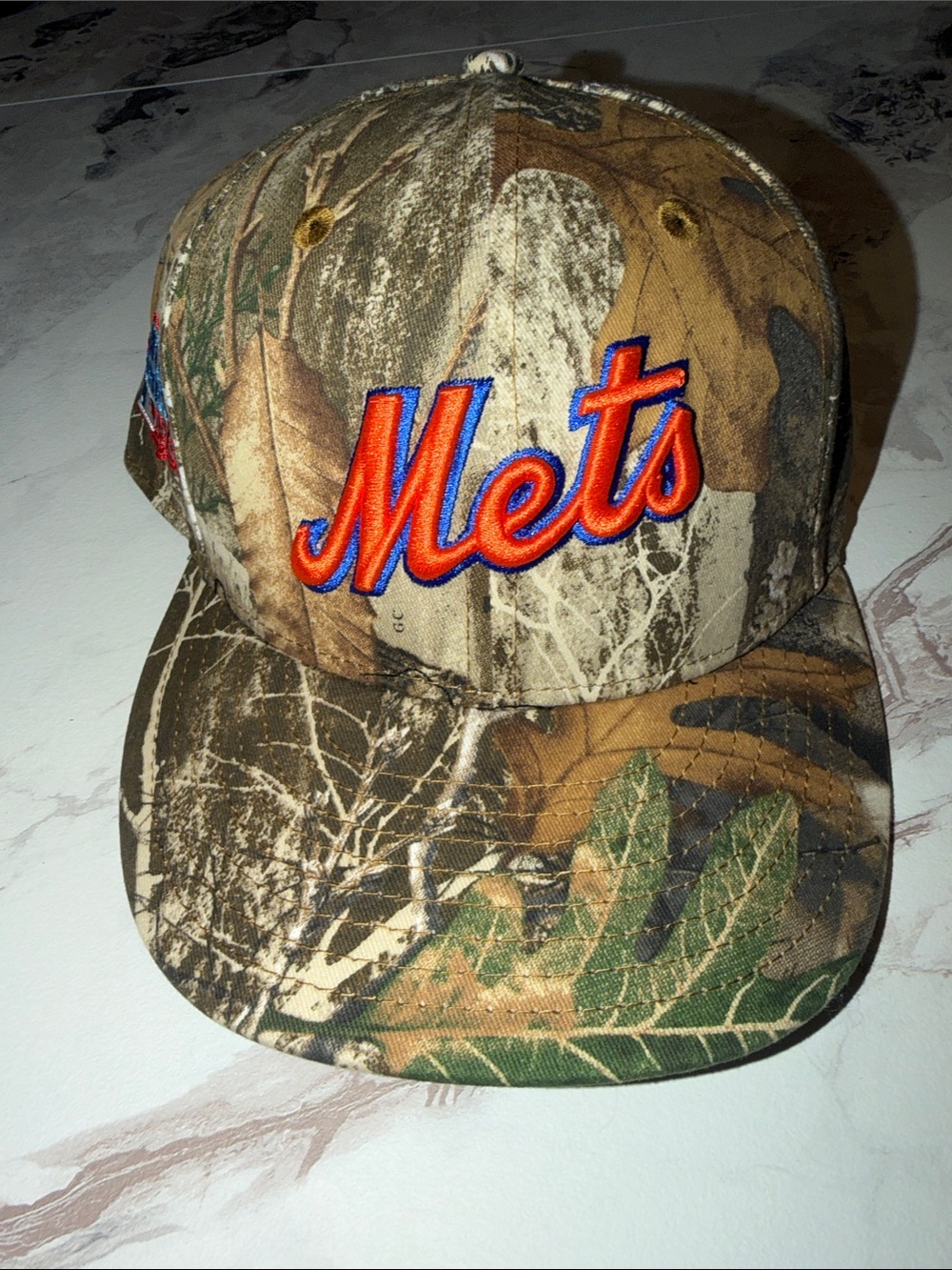 New Era Mets Camo Snapback Cap with Orange & Blue Embroidery